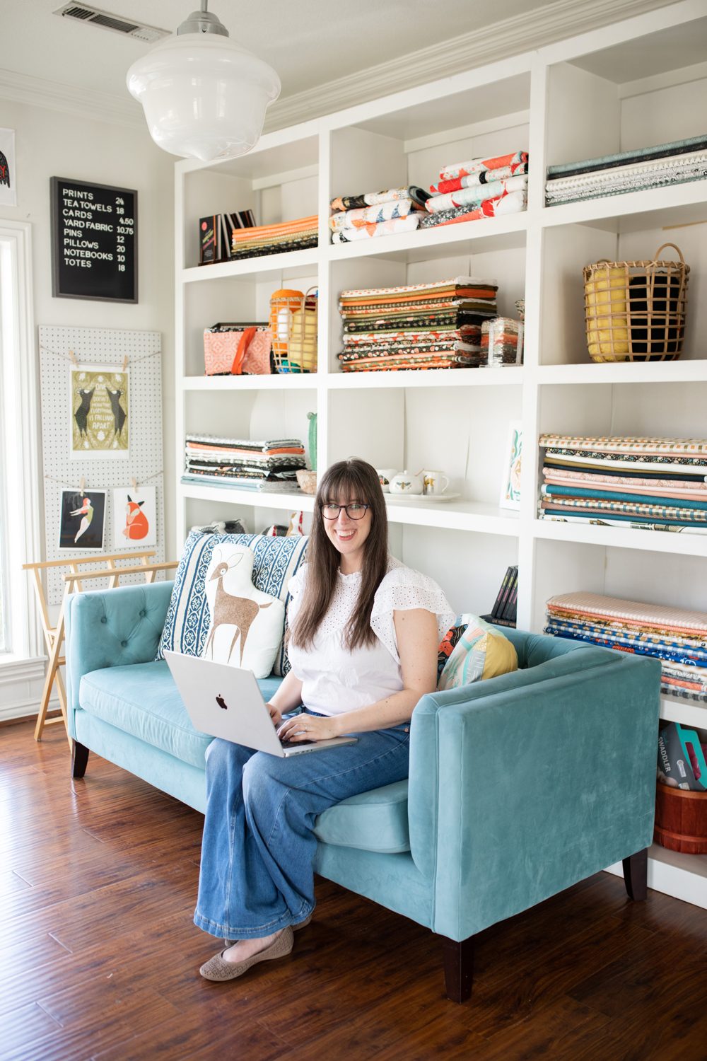 Stacie Bloomfield in an armchair with her laptop